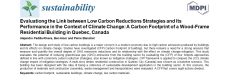 Evaluating the link between low carbon reductions strategies and its performance in the context of climate change: A carbon footprint of a qood-frame residential building in Quebec, Canada